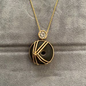 Diamond and gold "K" necklace with rock